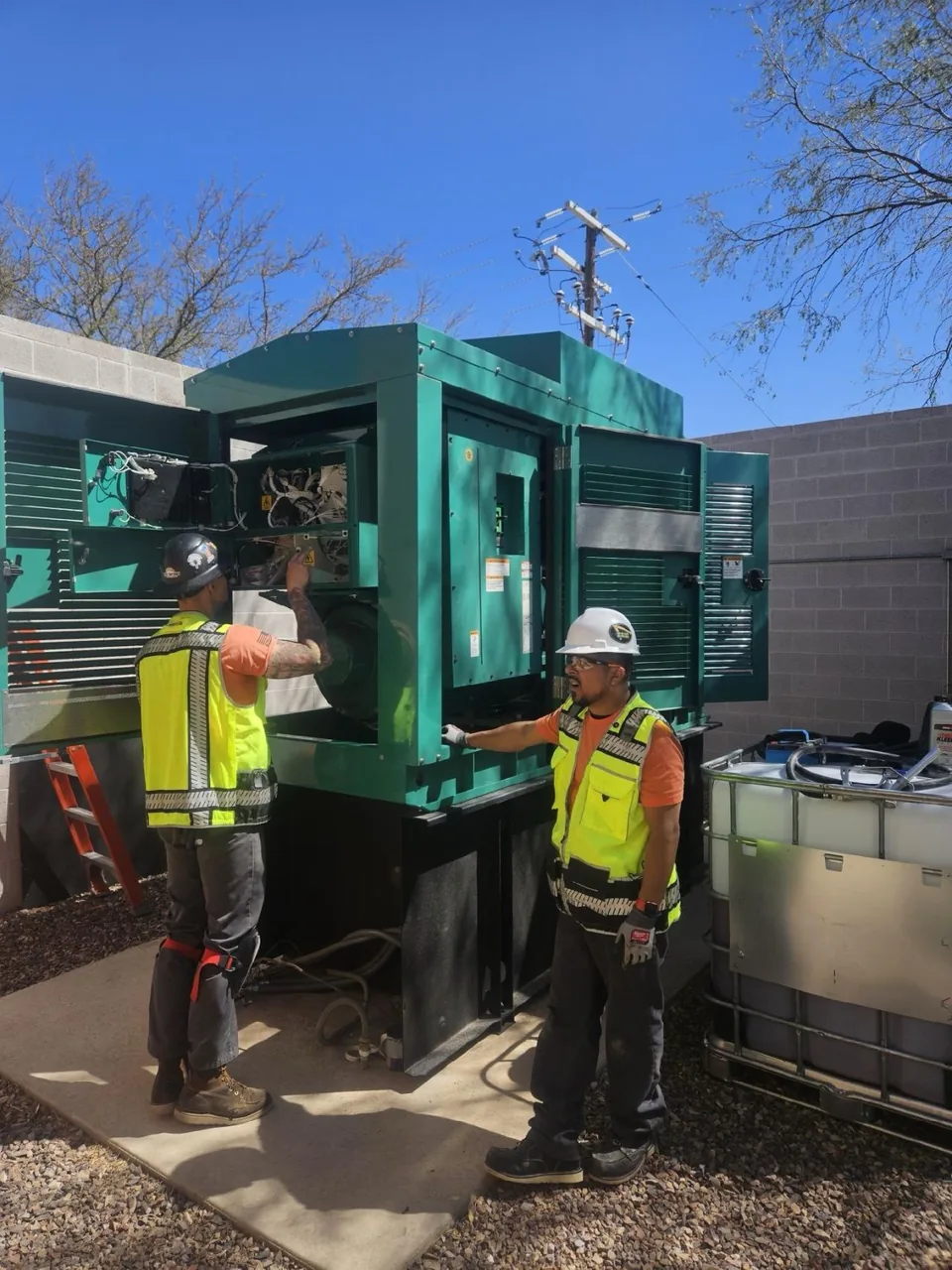 New Phase technicians servicing a Cummins standby generator at an Arizona facility