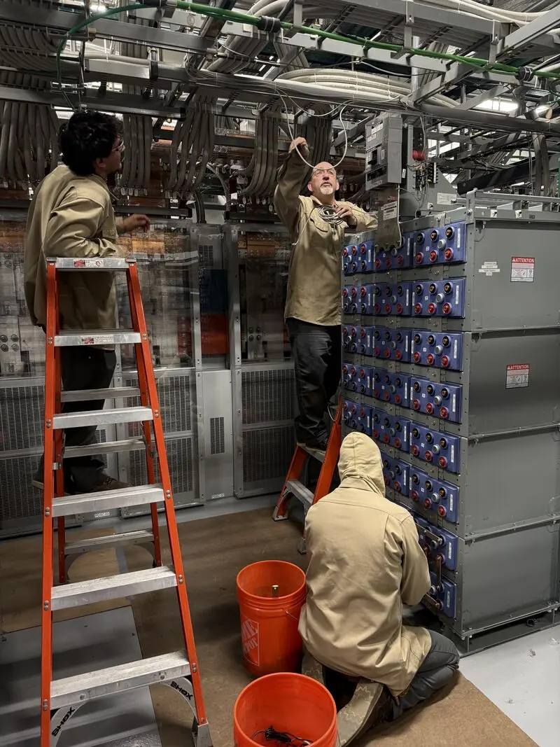 New Phase technicians servicing a stationary battery string at an Arizona facility